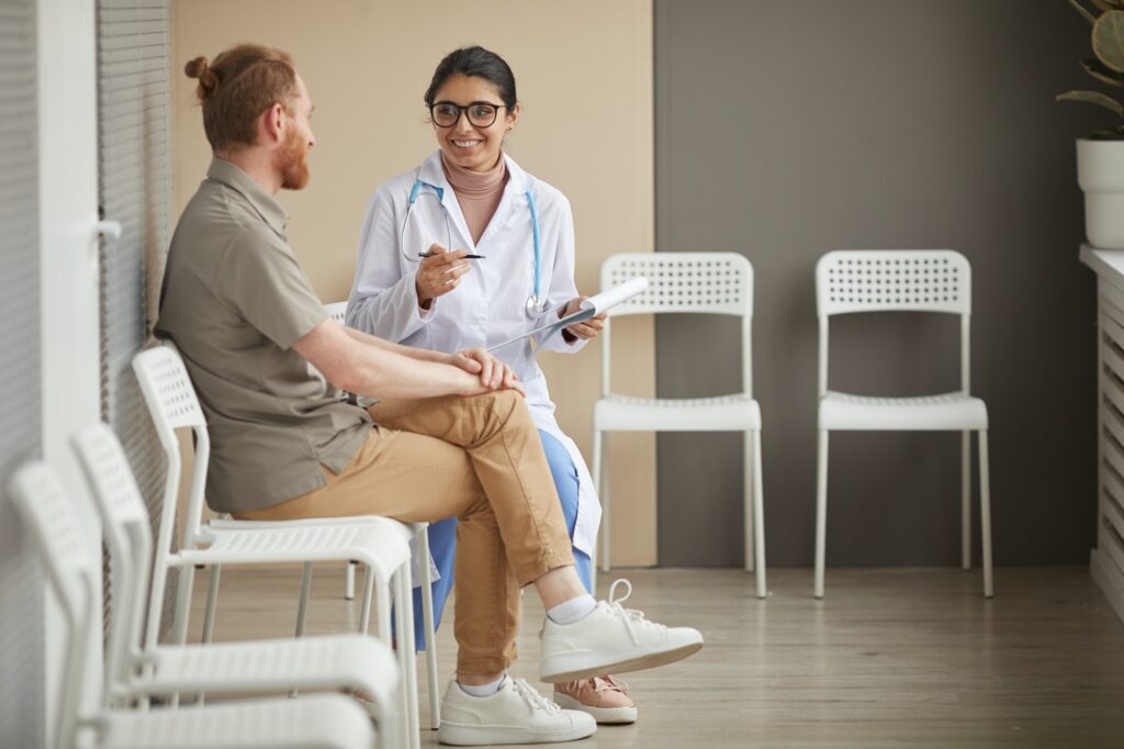 Nurse with patient at the corridor